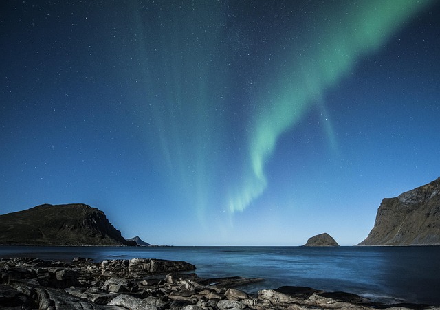 Northern lights over fjord